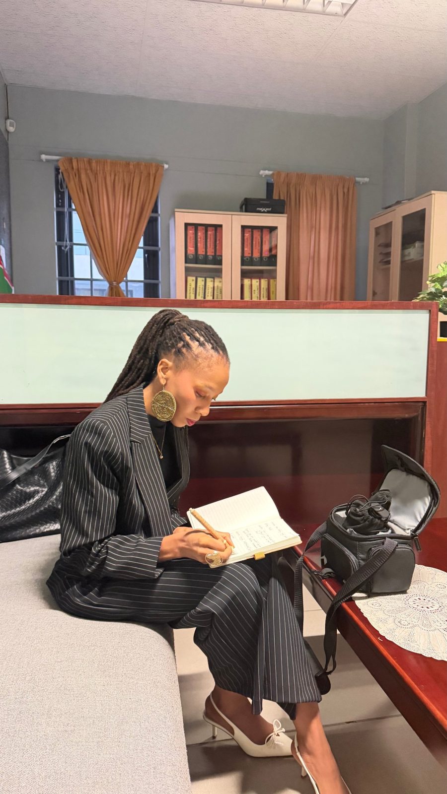 Mantate writing in a notebook